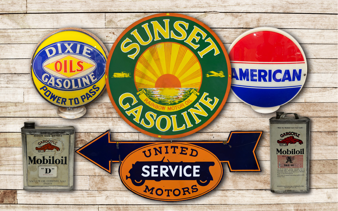 A variety of vintage metal signs with different designs and themes